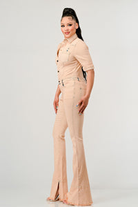 Button up Fitted Washed Denim Jumpsuit Elevate your style with the Rêve Dorés Washed Denim Half Sleeve Jumpsuit. This jumpsuit features a vintage washed denim fabric that exudes a cool and laid-back vibe. The button-up front adds a touch of retro charm, while the fitted style highlights your curves in all the right places.