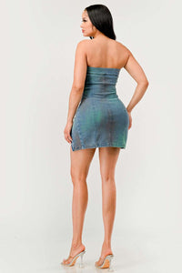 Denim Rush Hour Dress | Model wearing a strapless denim mini dress featuring a structured bust design, zipper accents on both sides creating adjustable slits, and subtle distressed details for a chic and edgy look - Rêves dorés