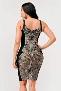 Stylish black dress featuring nude lace and cut-out details