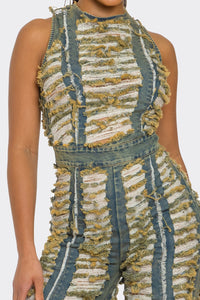 Close-up of textured fringe design on wide-leg jumpsuit ideal for summer vacations and parties