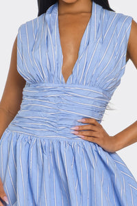 Close-up of ruched bodice and bubble skirt on sleeveless blue mini dress for date night or brunch
